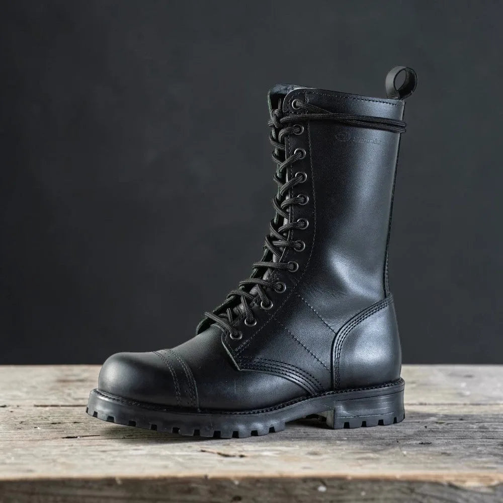 Side profile of tall black leather combat boot with lace-up front and pull loop at the top.