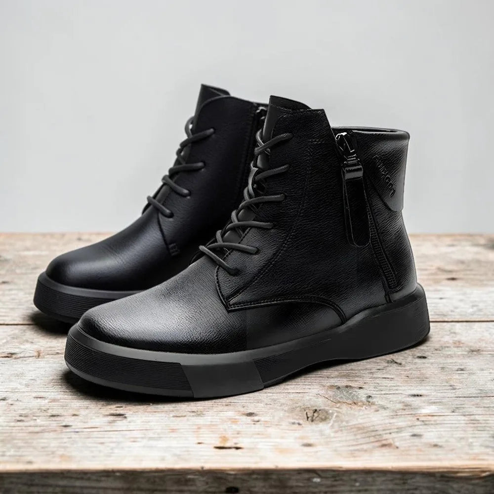 Pair of black grained leather combat boots with lace-up front, side zip and thick rubber sole